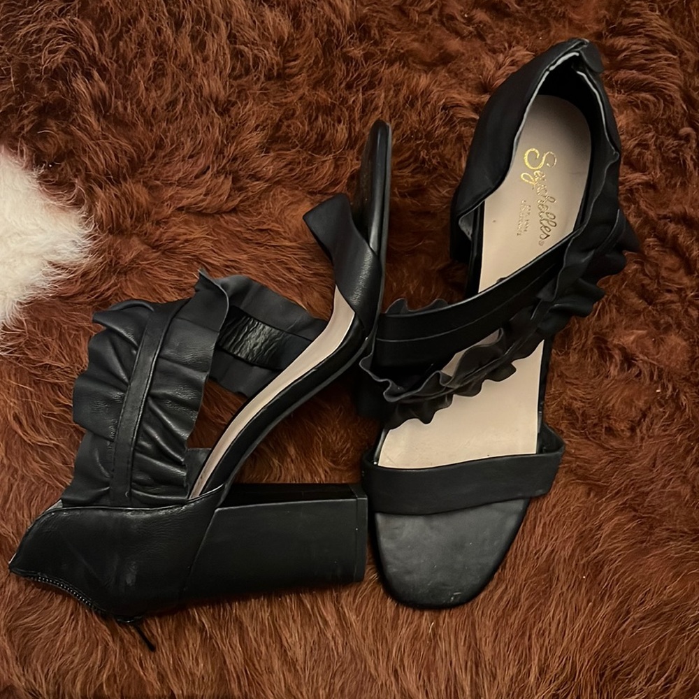 Never worn black heel